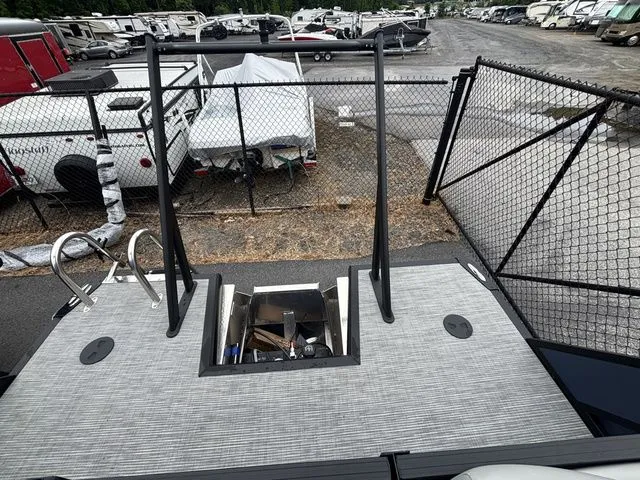 Slide: The Image of Rear view of a Viaggio Lago V22U with gray deck and black railing. - 19
