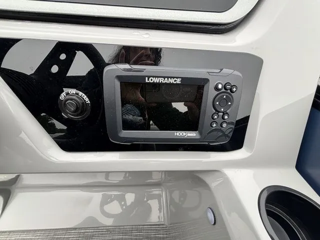 Slide: The Image of Close-up of a Lowrance HOOK Reveal fish finder on a boat. - 33