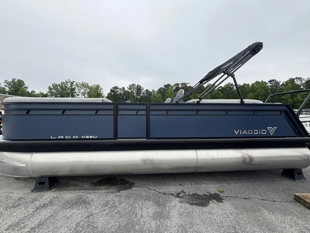 Slide: The Image of A Viaggio Lago V22U pontoon boat with a Mercury 150HP 4-stroke engine, parked on a lot. - 3