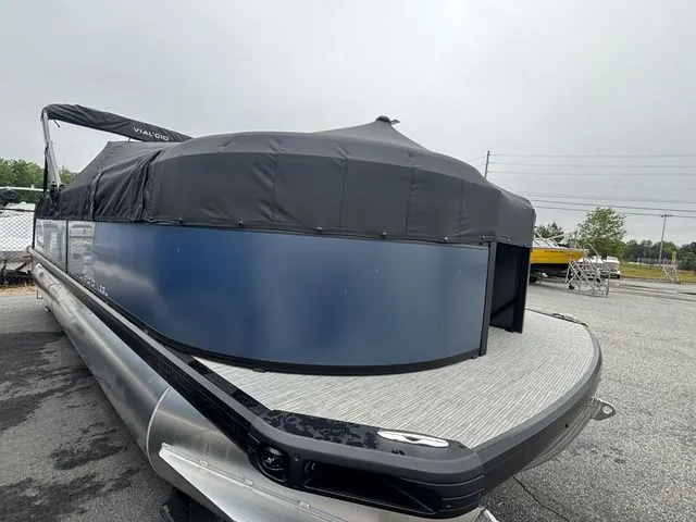 Slide: The Image of 2025 Viaggio Lago V22U with Mercury 150HP 4-stroke engine, covered and parked. - 6