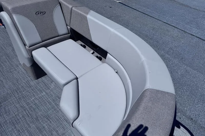 Slide: The Image of Interior seating of 2027 Manitou Aurora 23 RF SHP pontoon boat, featuring gray upholstery. - 25