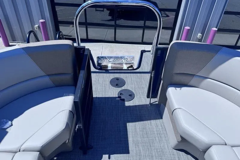 Slide: The Image of Interior view of 2027 Manitou Aurora 23 RF SHP pontoon boat with gray seating and flooring. - 31