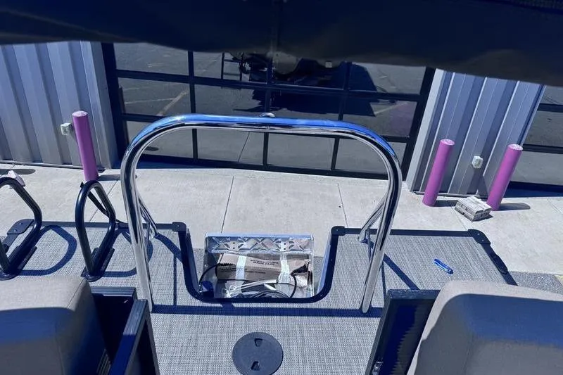 Slide: The Image of 2027 Manitou Aurora 23 RF SHP boat deck with chrome railing and modern design. - 32