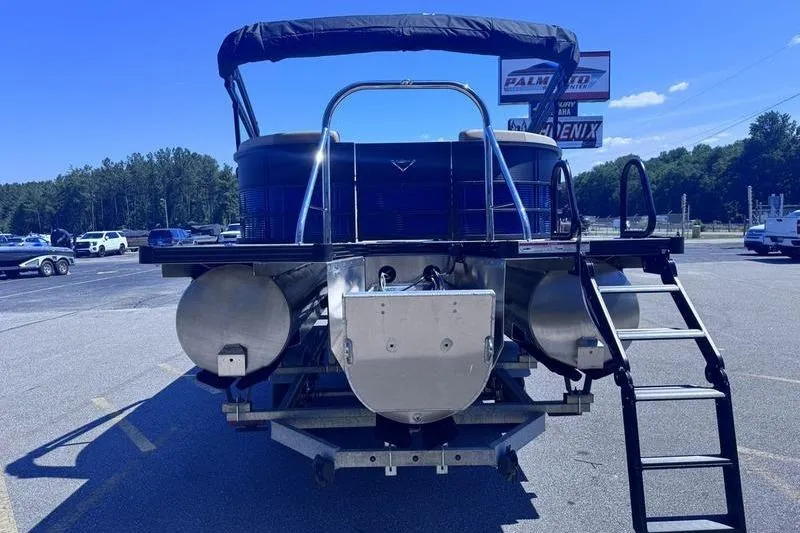 Slide: The Image of 2027 Manitou Aurora 23 RF SHP pontoon boat, rear view with ladder and canopy. - 8