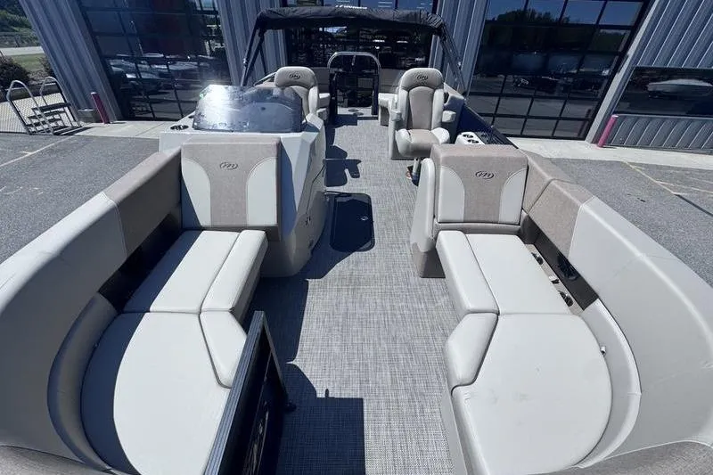 Slide: The Image of 2027 Manitou Aurora 23 RF SHP pontoon boat interior with spacious seating and modern design. - 19