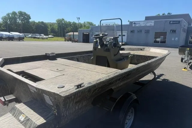 Slide: The Image of 2026 Tracker Grizzly 1860 CC boat on trailer in outdoor dealership lot. - 67