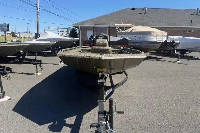 Slide: The Image of 2026 Tracker Grizzly 1860 CC boat on trailer in outdoor lot. - 4