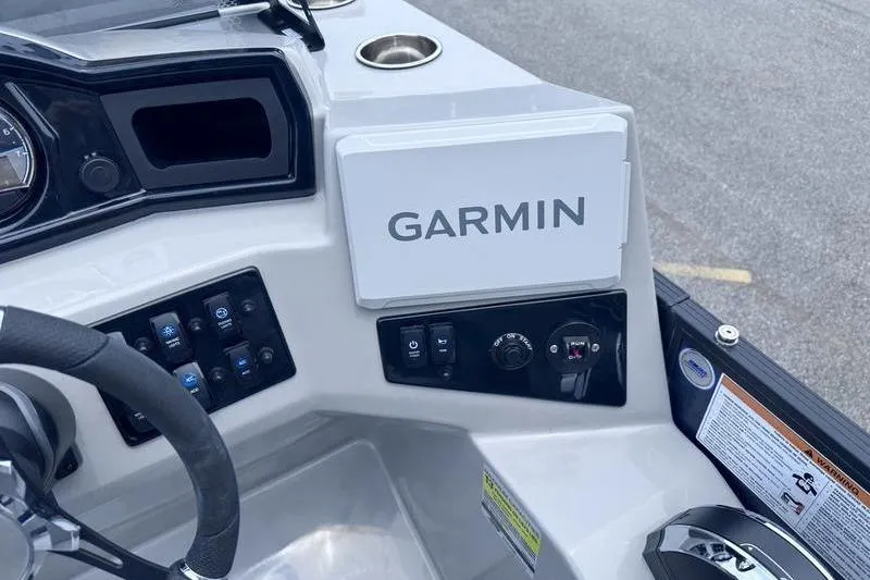 Slide: The Image of Dashboard of 2027 Manitou Aurora 23 SL SHP with Garmin navigation system. - 22