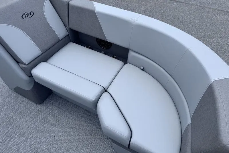 Slide: The Image of 2027 Manitou Aurora 23 SL SHP boat seating, featuring sleek gray upholstery and modern design. - 25