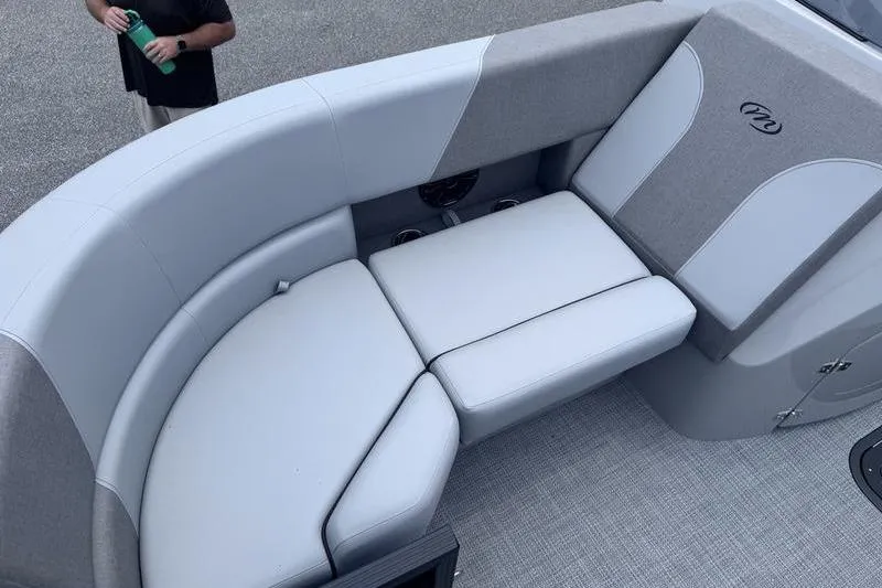 Slide: The Image of Luxurious seating on 2027 Manitou Aurora 23 SL SHP pontoon boat, featuring elegant gray upholstery. - 29