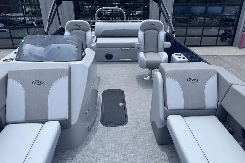 Slide: The Image of 2027 Manitou Aurora 23 SL SHP pontoon boat interior with gray seating and modern design. - 14