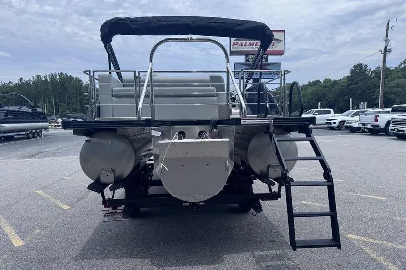 Slide: The Image of 2027 Manitou Aurora 23 SL SHP pontoon boat, rear view with ladder and seating. - 13