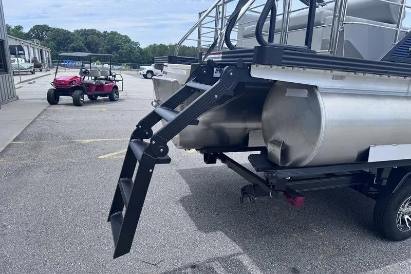 Slide: The Image of 2027 Manitou Aurora 23 SL SHP pontoon boat with rear ladder and trailer. - 10