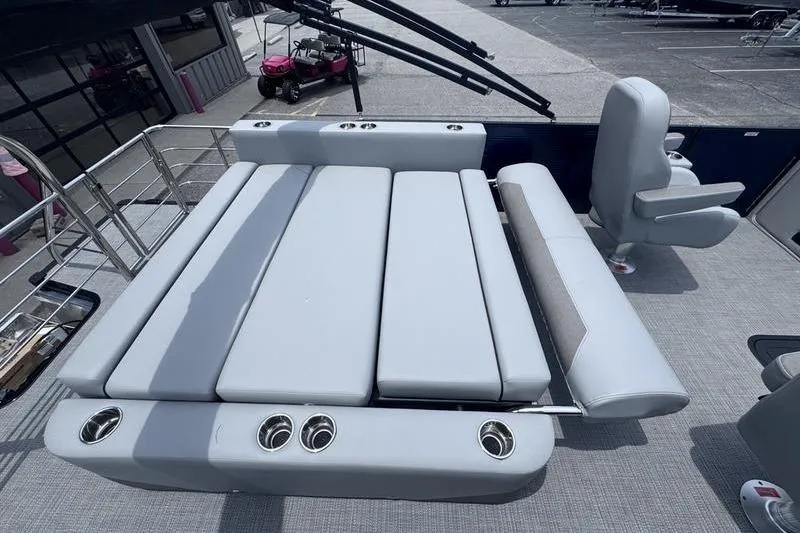 Slide: The Image of Luxurious seating area on 2027 Manitou Aurora 23 SL SHP pontoon boat, featuring modern design and comfort. - 30