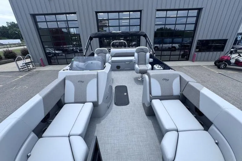 Slide: The Image of 2027 Manitou Aurora 23 SL SHP pontoon boat with spacious seating and modern design. - 9