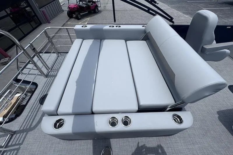 Slide: The Image of Luxurious seating on 2027 Manitou Aurora 23 SL SHP pontoon boat with cup holders. - 27