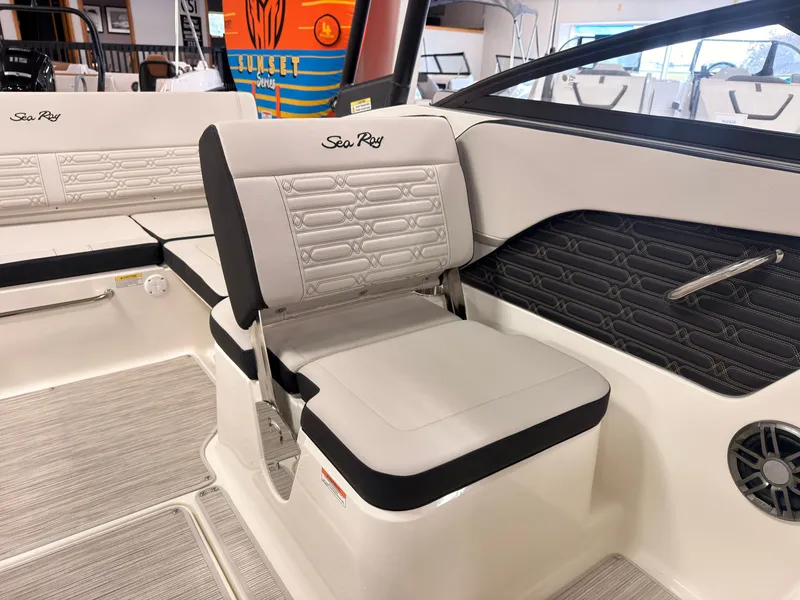 Slide: The Image of Interior view of a Sea Ray SPX 210 boat with gray upholstered seats and modern design. - 22