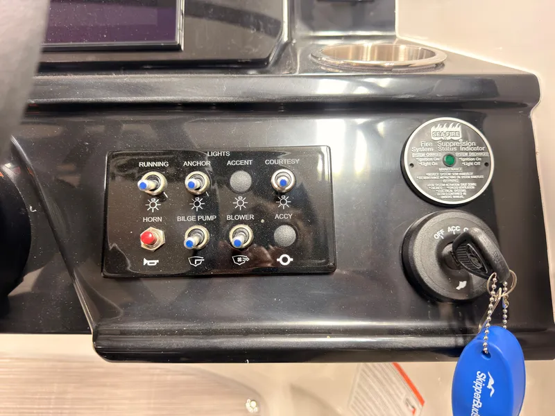 Slide: The Image of Dashboard with switches for lights, horn, and bilge pump. - 31