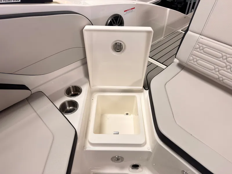 Slide: The Image of The image shows an open storage compartment on a 2026 Sea Ray SPX 210 boat. - 17