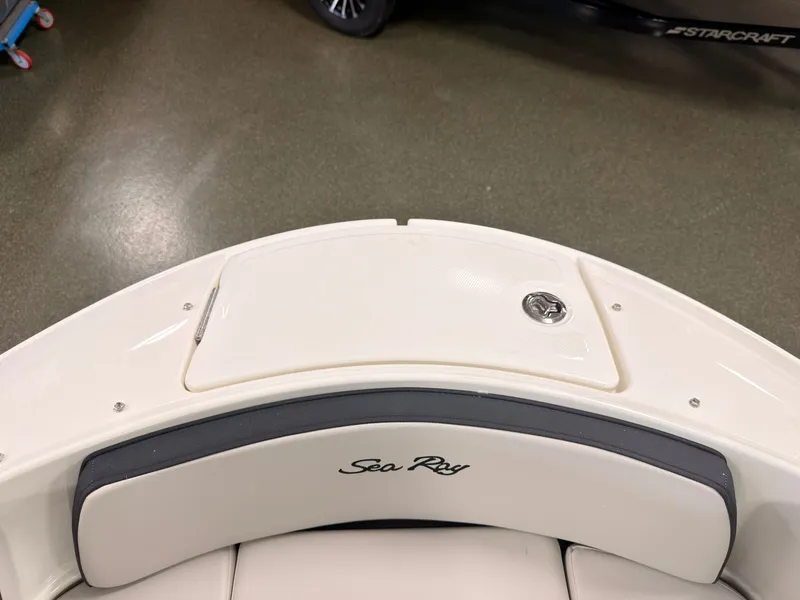 Slide: The Image of The image shows the stern of a Sea Ray SPX 210 boat with a cushioned seat. - 45