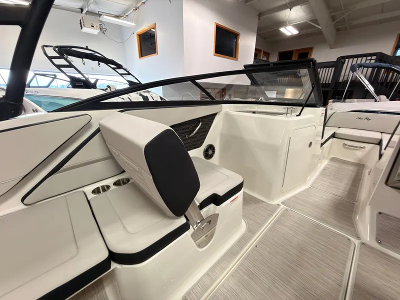 Slide: The Image of The image shows the interior of a 2026 Sea Ray SPX 210 boat with modern seating. - 21
