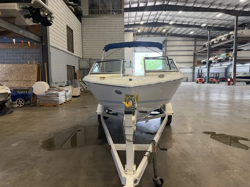 Slide: The Image of A 2015 Cobalt 200 boat on a trailer inside a warehouse. - 7