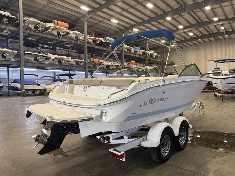 Slide: The Image of A 2015 Cobalt 200 boat on a trailer in a warehouse. - 4