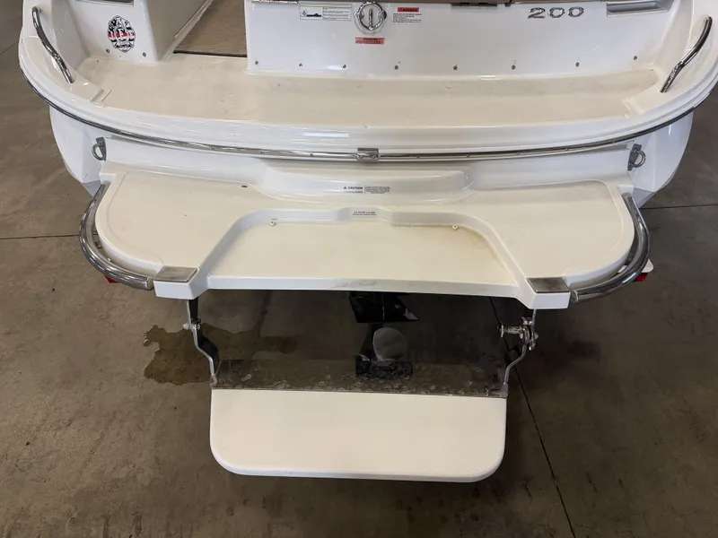 Slide: The Image of The image shows the stern of a 2015 Cobalt 200 boat with a swim platform. - 11