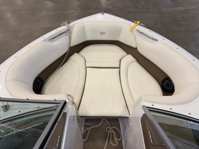 Slide: The Image of The image shows the bow area of a 2015 Cobalt 200 boat with white upholstery. - 37