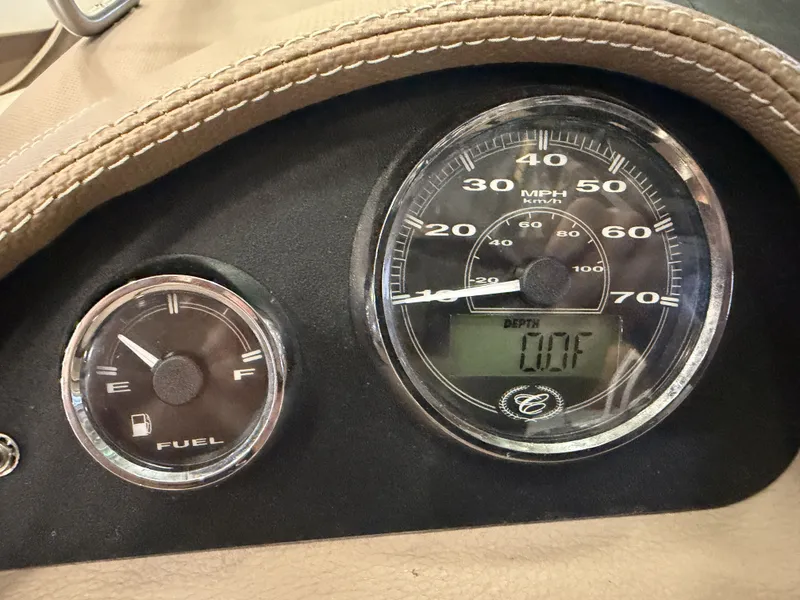 Slide: The Image of Close-up of speedometer and fuel gauge in a Cobalt 200 boat. - 30