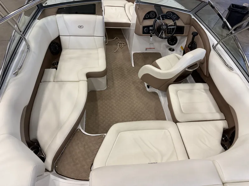 Slide: The Image of Interior of a 2015 Cobalt 200 boat with white and brown seating. - 17