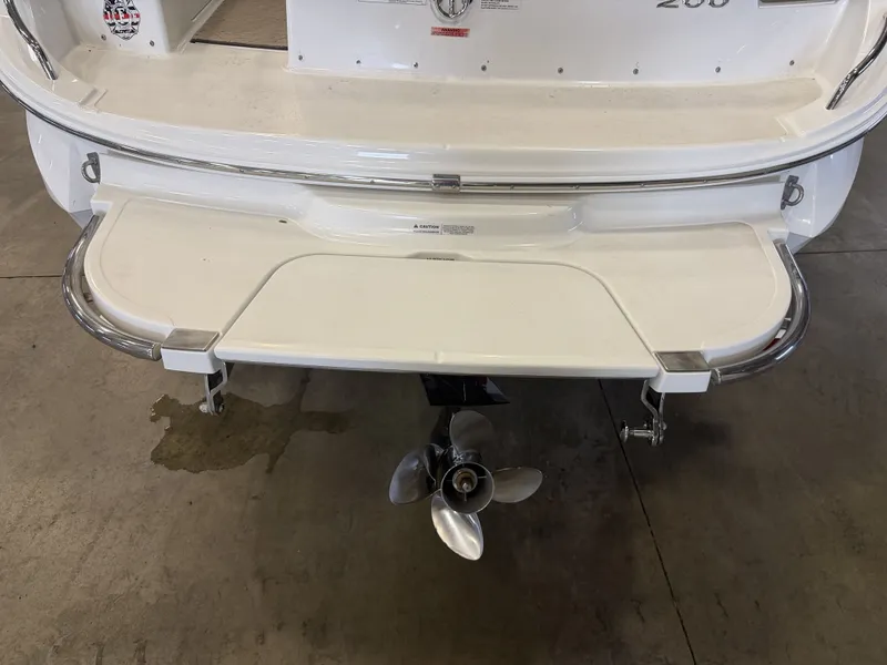 Slide: The Image of The image shows the stern of a 2015 Cobalt 200 boat with a stainless steel propeller. - 10