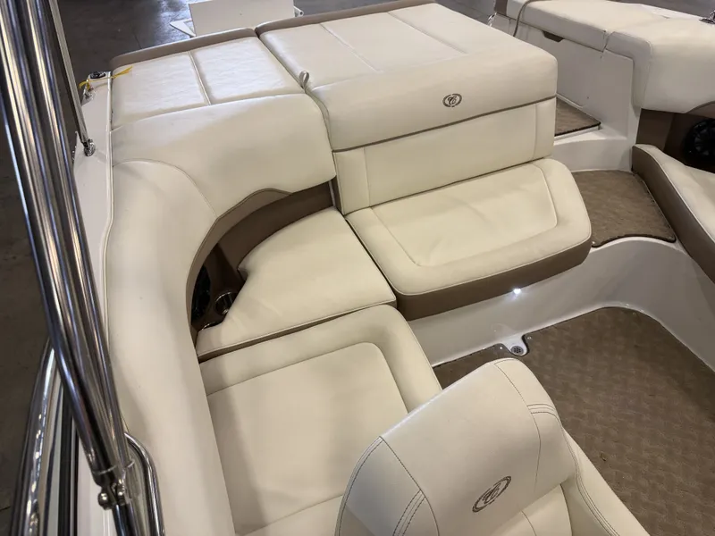 Slide: The Image of Interior of a 2015 Cobalt 200 boat with beige and white upholstery. - 20