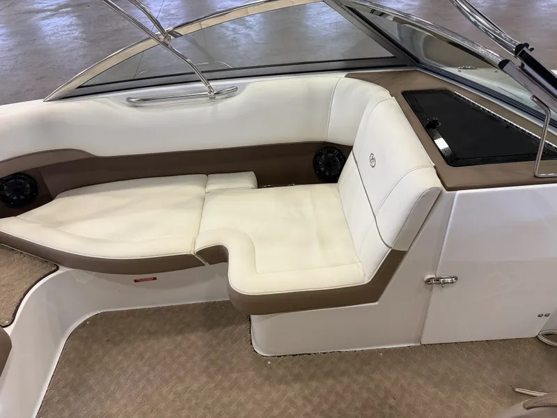Slide: The Image of Interior of a 2015 Cobalt 200 boat with white and brown seating. - 22