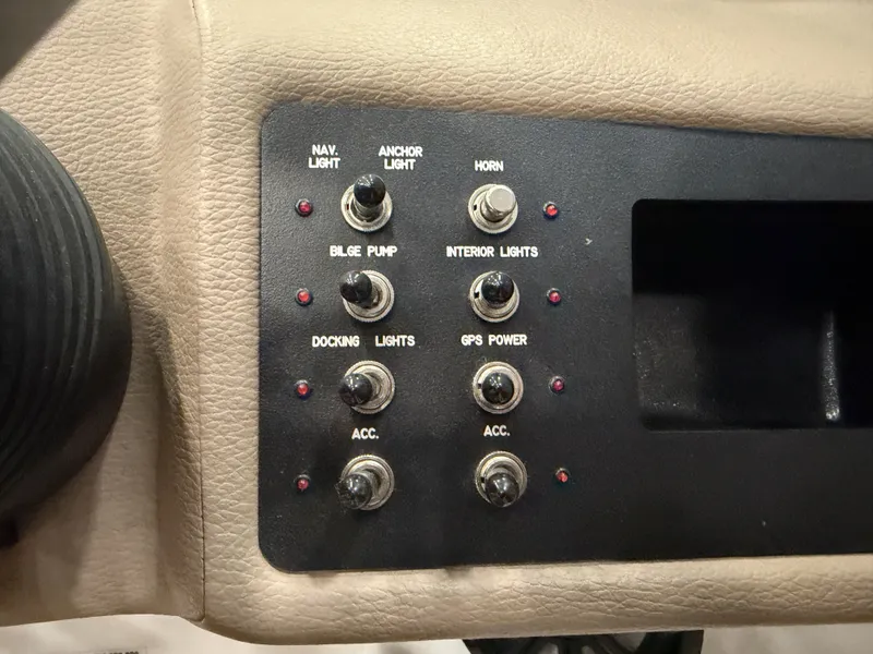 Slide: The Image of Control panel of a Cobalt 200 boat with various switches and indicator lights. - 34