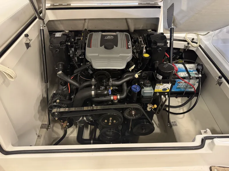Slide: The Image of Engine compartment of a 2015 Cobalt 200 boat with a clean engine and battery. - 43