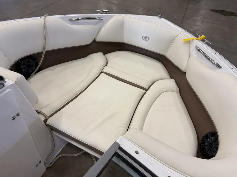 Slide: The Image of The image shows the bow area of a Cobalt 200 boat with white and brown upholstery. - 40