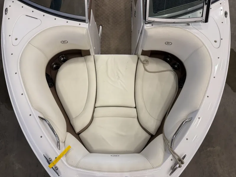 Slide: The Image of The image shows the bow area of a 2015 Cobalt 200 boat with white upholstery. - 38