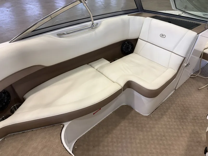 Slide: The Image of Interior of a 2015 Cobalt 200 boat with white and brown seating. - 21