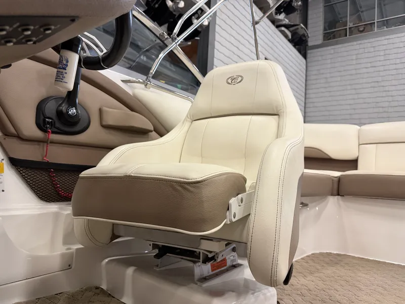 Slide: The Image of Interior view of a 2015 Cobalt 200 boat with beige and white seating. - 26
