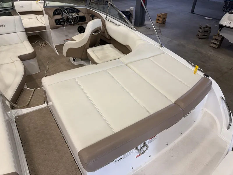 Slide: The Image of Interior view of a 2015 Cobalt 200 boat with white and brown seating. - 15