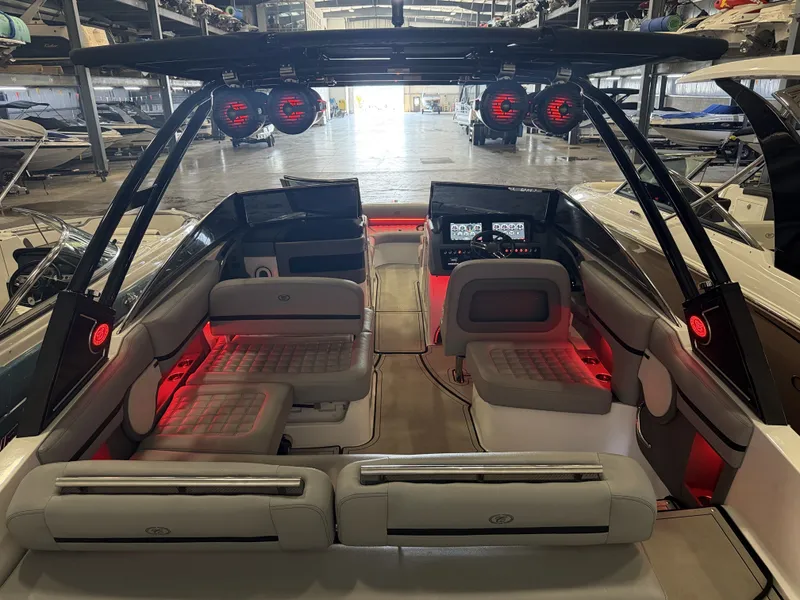 Slide: The Image of The image shows the interior of a 2022 Cobalt R30 boat with stylish lighting. - 17