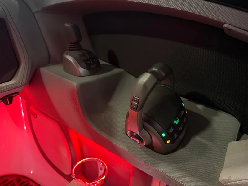 Slide: The Image of The image shows the control console of a Cobalt R30 boat with illuminated controls. - 39