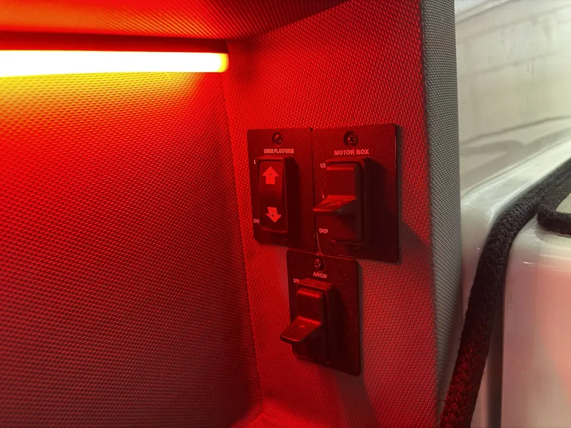 Slide: The Image of Close-up of switches with red lighting in a boat. - 28