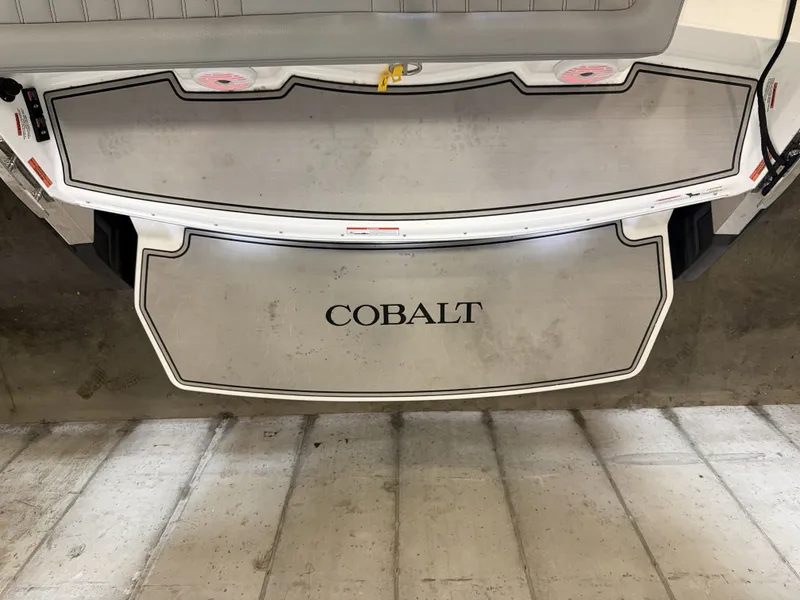 Slide: The Image of The image shows the stern of a 2022 Cobalt R30 boat with a large swim platform. - 11