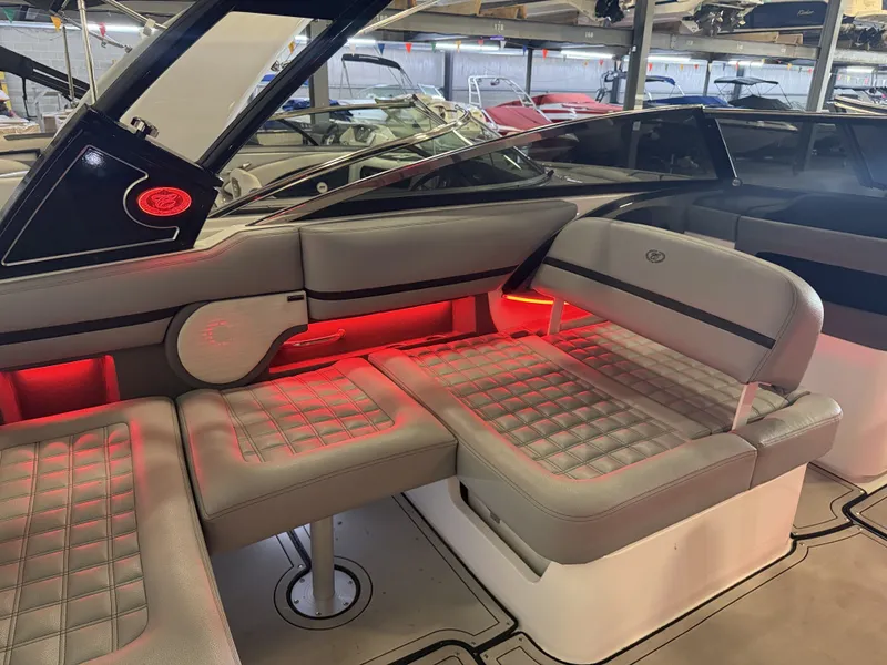 Slide: The Image of The image shows the interior of a 2022 Cobalt R30 boat with stylish lighting. - 23