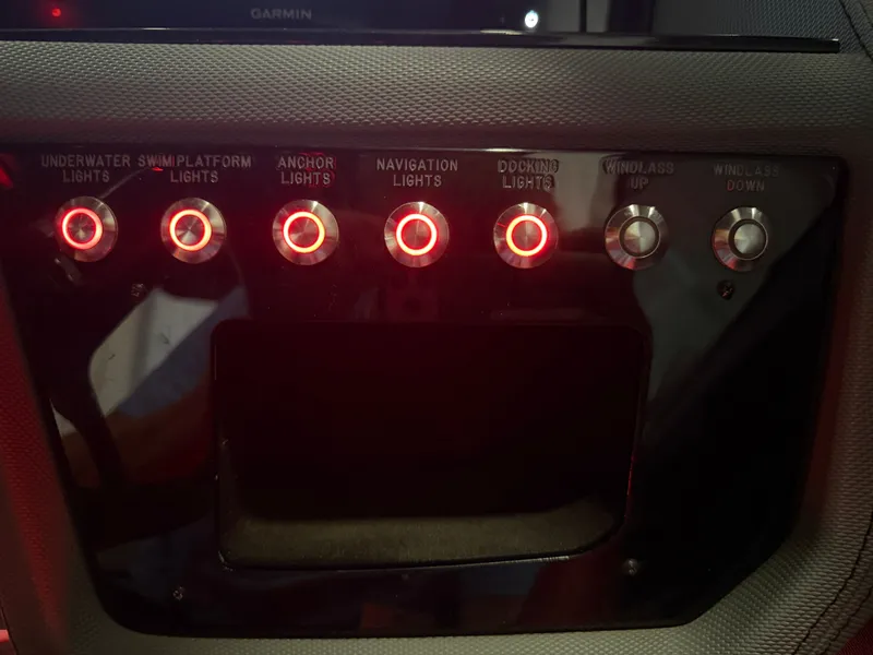 Slide: The Image of The image shows a control panel with illuminated switches for boat lights and anchor windlass. - 37
