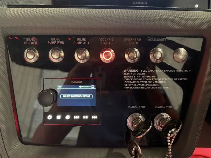 Slide: The Image of The image shows a control panel with various switches and a display. There are switches for bilge blowers, bilge pumps, and cockpit lights. - 36