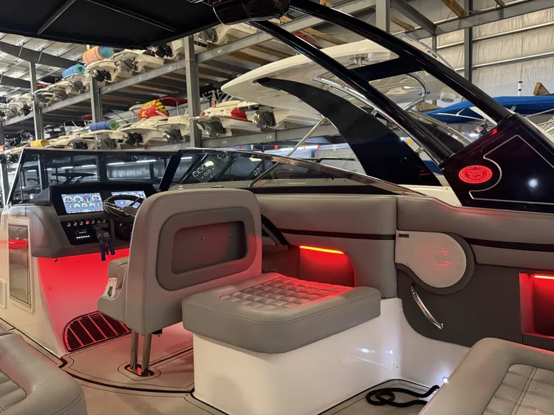 Slide: The Image of The image shows the cockpit of a 2022 Cobalt R30 boat with modern instruments and red accents. - 27
