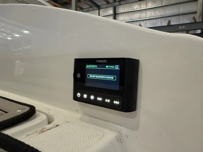 Slide: The Image of A Fusion audio system is installed in the white interior of a 2022 Cobalt R30 boat. - 12